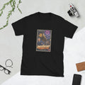 Black t-shirt printed with a vintage-style horror poster: a giant golden eye inside a brass telescope above an older woman astronomer and a young technician, an eclipse overhead, titled The Observatory of Closed Eyes