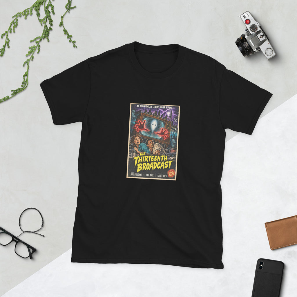 Black t-shirt printed with a vintage-style horror poster: a pale face on an old TV screen, red hands reaching out toward two frightened people, titled The Thirteenth Broadcast